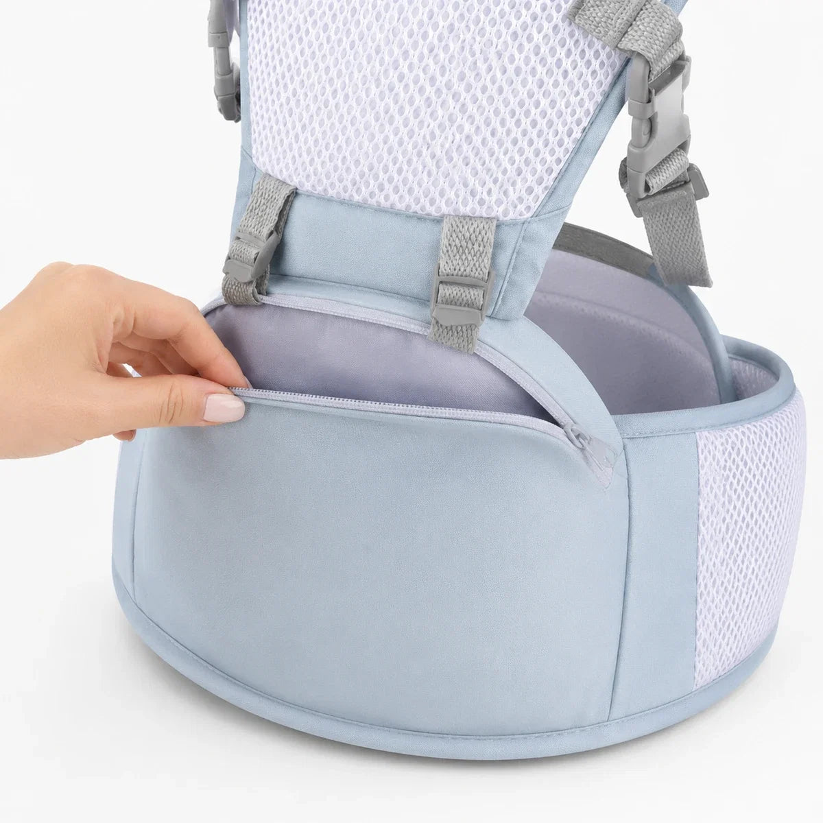 A hand opening the zipped storage pocket built into the waist belt of the LORAVI Ergonomic Hip Seat